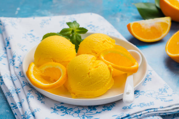 istock Orange ice cream. Summer orange sorbet 964129562