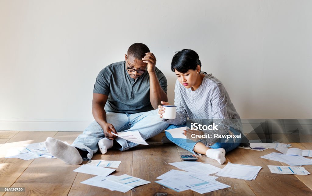 Couple managing the debt Couple managing the debt
***These documents are our own generic designs. They do not infringe on any copyrighted designs. Debt Stock Photo