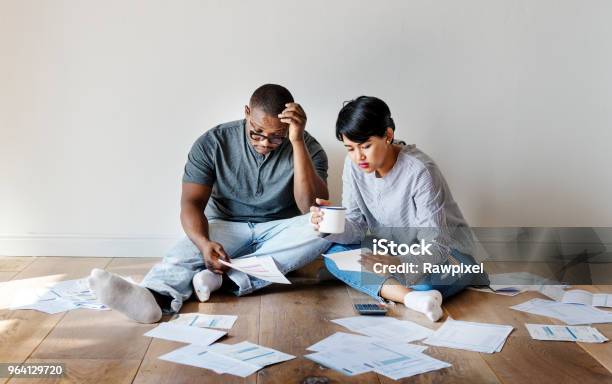 Couple Managing The Debt Stock Photo - Download Image Now - Debt, Tax, Expense