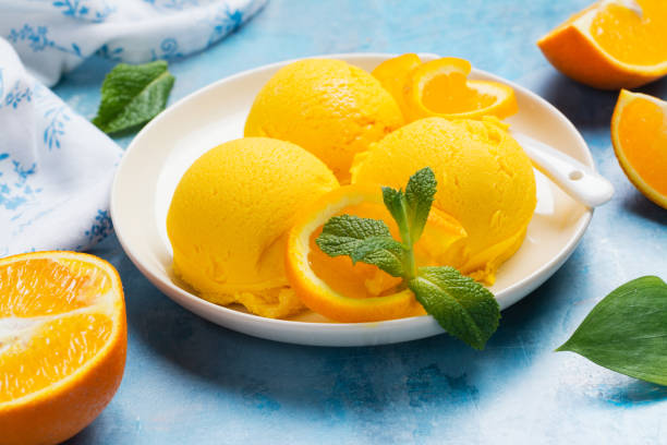 istock Orange ice cream. Summer orange sorbet 964132748