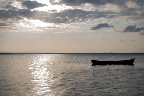 istock sunset by canoe over the ocean 964136036