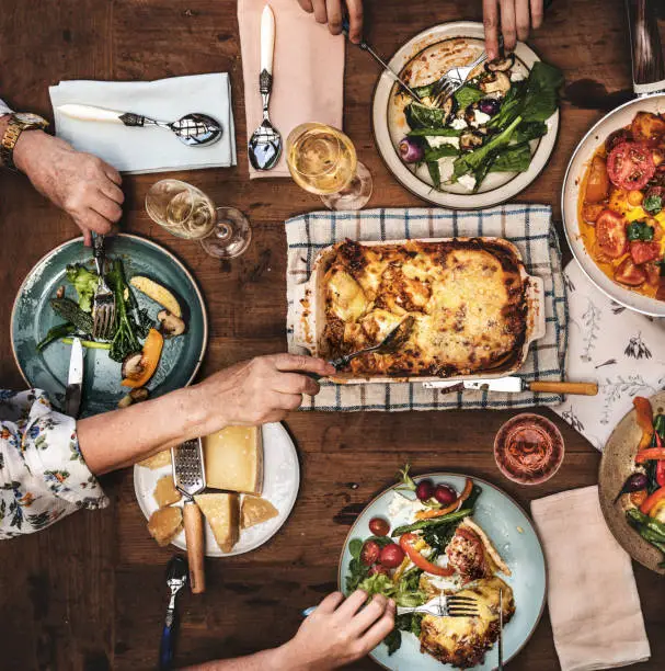 Photo of Adults having a dinner party