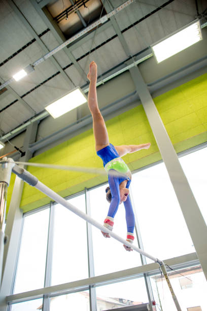 istock Young Gymnastics Athlete Exercising on Horizontal Bar 964139236