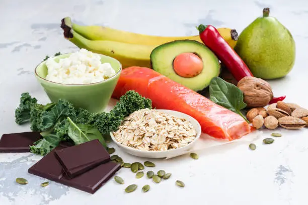 Assortment of food - natural sources of dopamine. Food good for brain on white background. Copy space