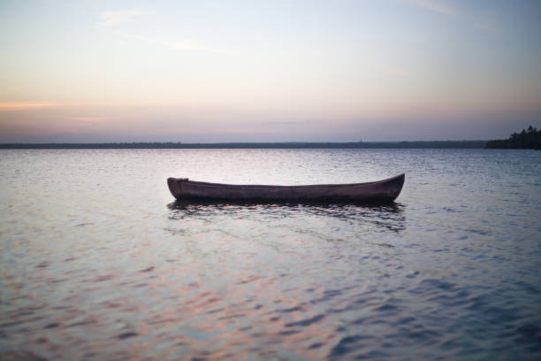 istock sunset by canoe over the ocean 964140020