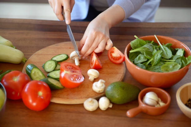 istock woman cooking in the kitchen 964143394