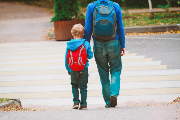 istock father and son go to school, education 964144316