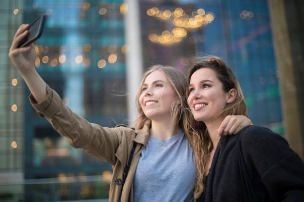 istock Two friends making a selfie at the city. 964146932