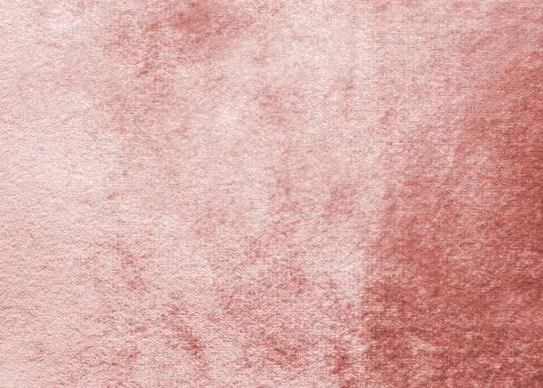 Rose gold pink velvet background or velour flannel texture made of cotton or wool with soft fluffy velvety satin fabric cloth metallic color material