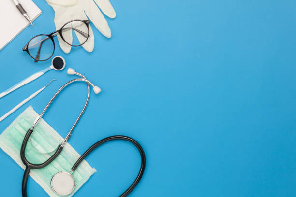 Table top view aerial image of accessories healthcare & medical background concept.Essential instruments or equipment tools on blue paper.Flat lay essential items for doctor using treat patient. Table top view aerial image of accessories healthcare & medical background concept.Essential instruments or equipment tools on blue paper.Flat lay essential items for doctor using treat patient. doctor utensils stock pictures, royalty-free photos & images