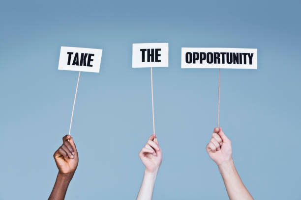 istock Three hands hold up signs reading 