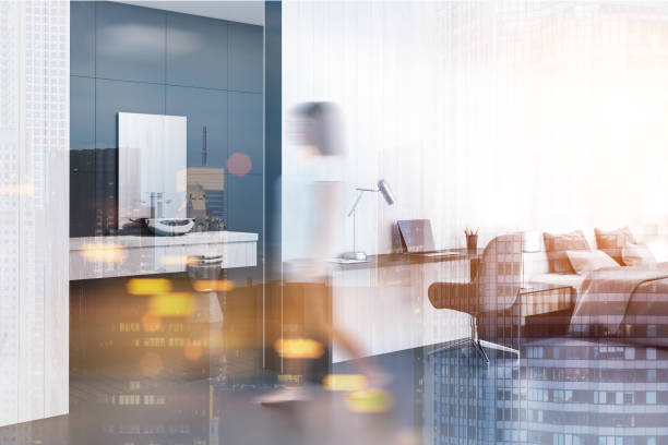 istock Woman in a white studio apartment 964163090