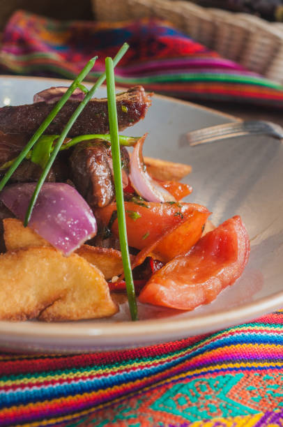 istock Lomo saltado traditional peruvian plate with beef and potatoes 964163602