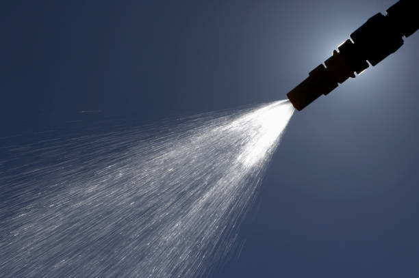 istock WATER SPRAYING FROM GARDEN HOSE PIPE 964164372