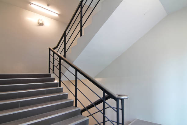 istock Stairwell to emergency exit or stairwell fire escape in office building. 964171602