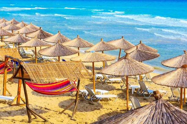 istock beach background with turquoise sea and umbrellas 964176186