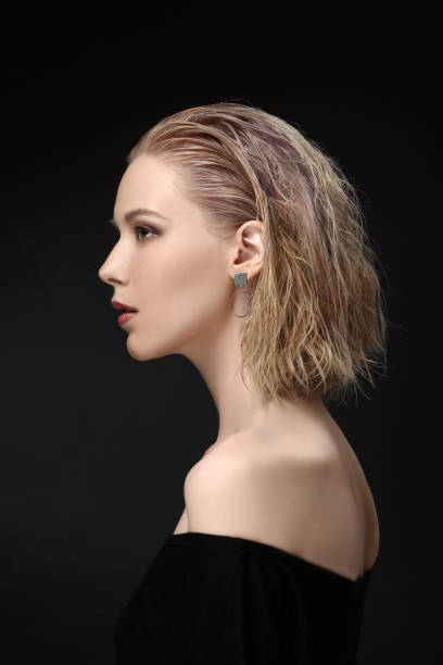 Beautiful Girl Model Blonde With Curly Hair On A Black Background In  Profile Stock Photo - Download Image Now - iStock