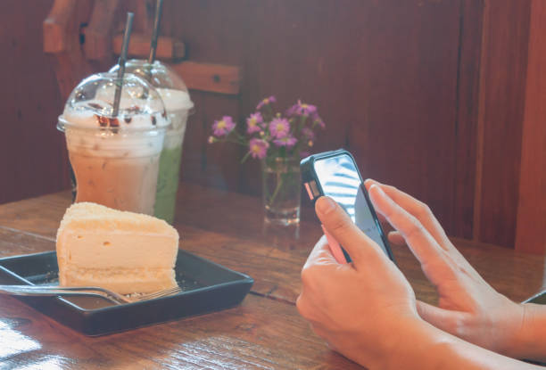istock Close-Up Of Breakfast On Table While Person Using Phone 964181246