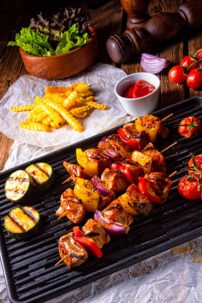 istock Rustic shish kebab skewers with marinated ham meat paprika and red onion 964185688