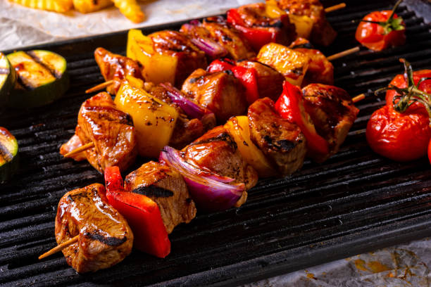 istock Rustic shish kebab skewers with marinated ham meat paprika and red onion 964185974