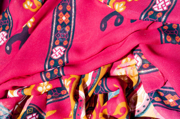 istock Background texture, pattern. Red maroon fabric. Click on your local heritage with this red, bard and yellow striped silk. This patterned fabric will decorate your design. your work will be exclusive 964187306