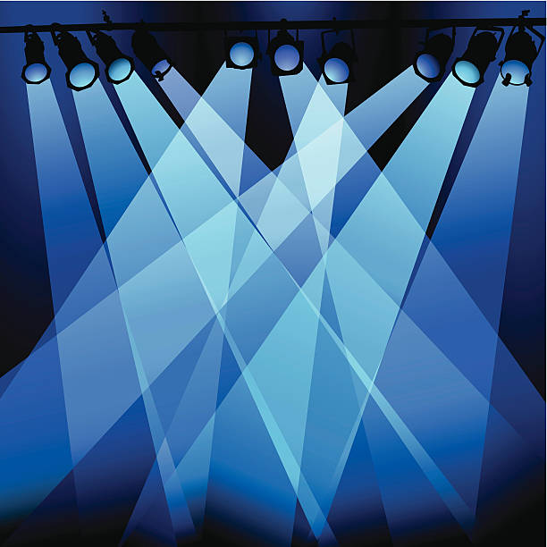 Blue Lights Blue stage lights illuminating a space. stage lights stock illustrations