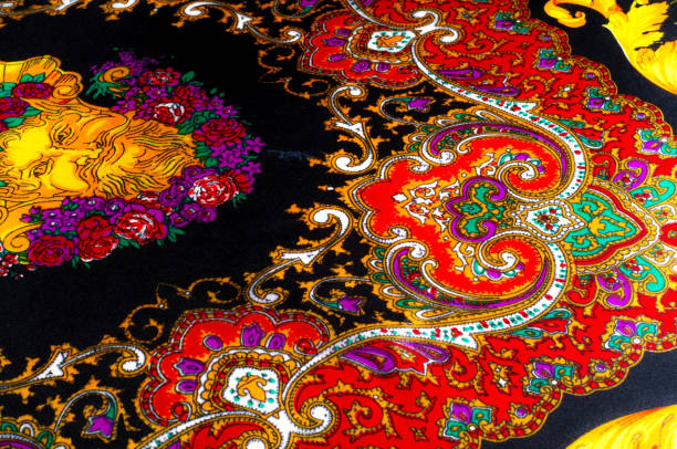 istock Background texture, drawing. Silk fabric. Fabric with bright patterns of yellow and red colors, Indian fabric, silk fabric around the yard, printed silk, printed fabric Sanganery 964189750