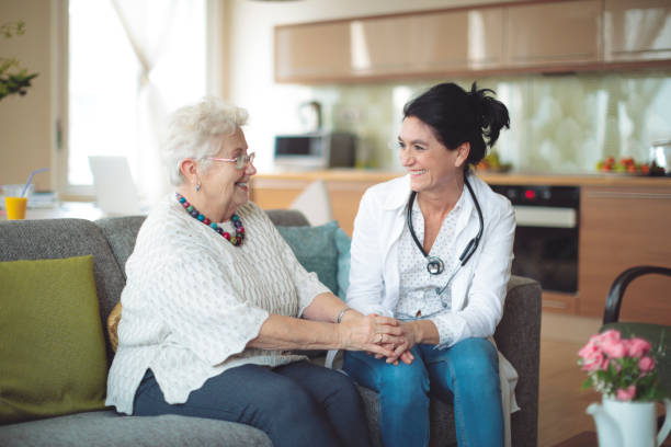 istock Social worker is visiting a senior woman 964190850