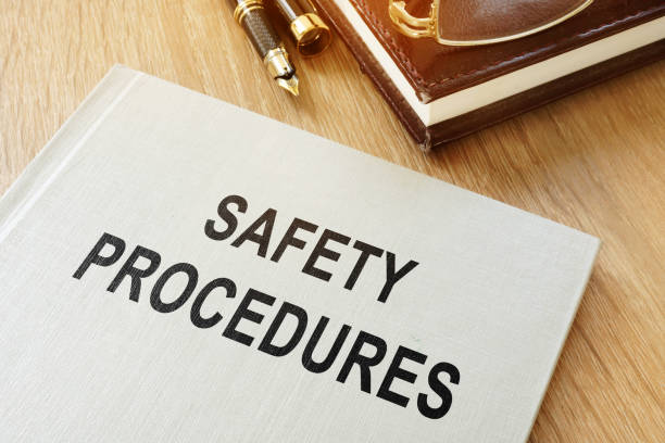 istock Safety procedures manual on an office desk. 964197096
