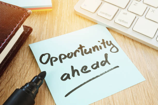 istock Opportunity ahead written on a memo stick. 964199382