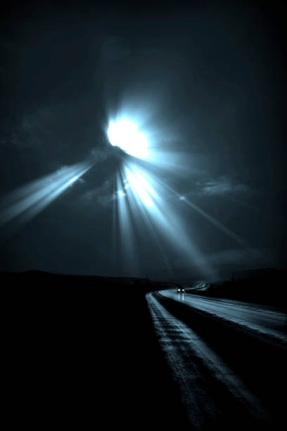 istock Single car travels on dark road 964201598
