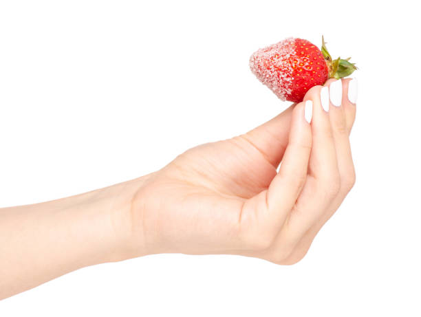 istock Strawberries in sugar in a hand 964201608