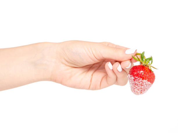 istock Strawberries in sugar in a hand 964201616