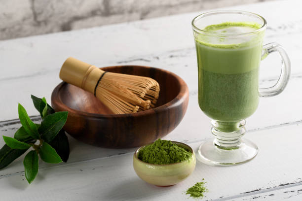 istock Matcha green tea latte beverage in glass cup on white background 964204448