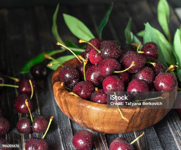 Fresh Sweet Cherries In Plate On Dark Wooden Background With Copy Space Summer And Harvest Concept Cherry Macro Vegan Vegetarian Raw Food Stock Photo - Download Image Now