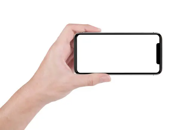 Photo of hand holding horizontal the black smartphone with white screen.