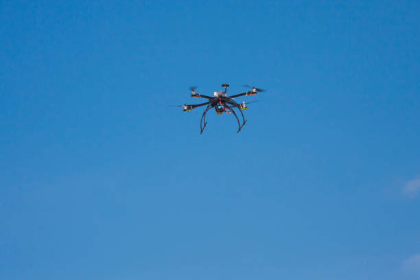 istock quadcopter drone for hobby on clear blue sky 964208070
