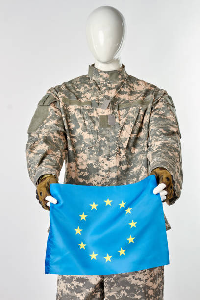 istock Mannequin soldier holding european flag. 964212098