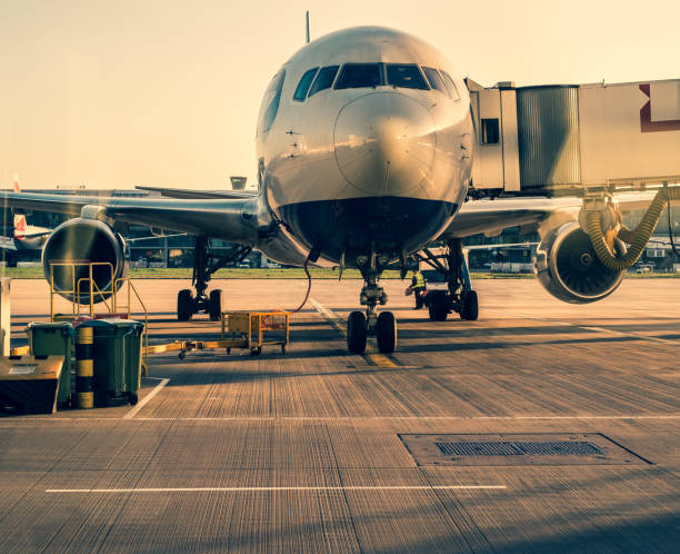 front view of landed airplane in a terminal of heathrow airport; london uk. - heathrow airport imagens e fotografias de stock