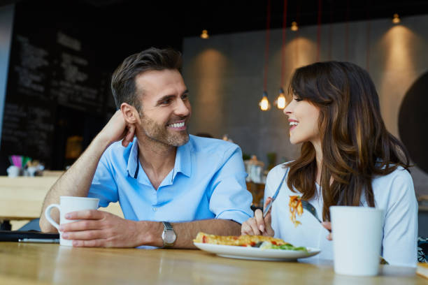 istock Couple at cafe talking during lunch 964213356