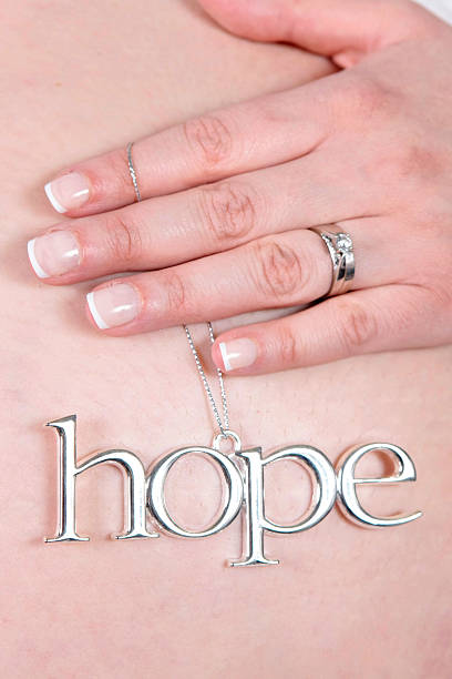 Hope Sign on Belly of pregnant woman stock photo