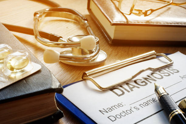 istock Medicine concept. Diagnosis form, stethoscope and medicines on a desk. 964216236