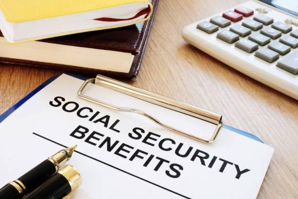 istock Social security benefits. Clipboard on a desk. 964216582