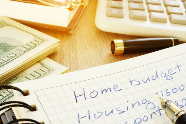 istock Home budget, calculator and dollar bills on a desk. 964216770