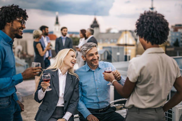 istock Cheerful managers having fun at the outdoor party. 964217232