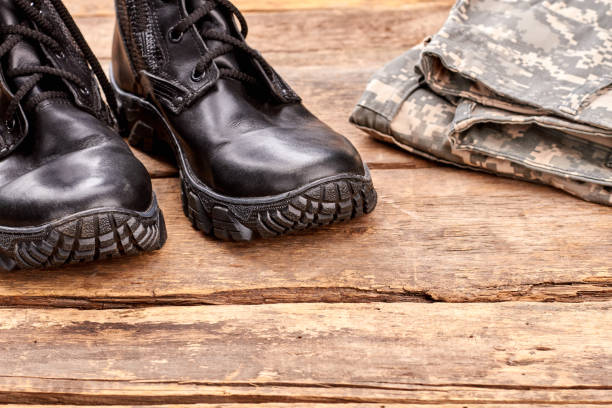 istock Extreme close up black soldier boots. 964219552