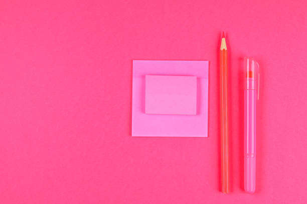 istock Pink felt-tip pen, pencil and sheets for notes on a pink pastel background. Summer. Top view. Flat lay. Copy space. 964219564
