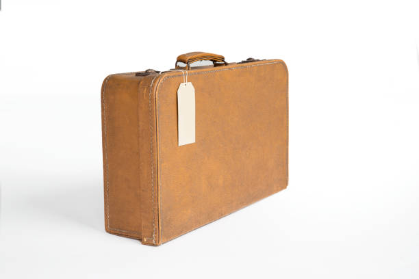 Vintage Suitcase Vintage Leather Suitcase With Blank Label suitcase luggage old fashioned obsolete stock pictures, royalty-free photos & images