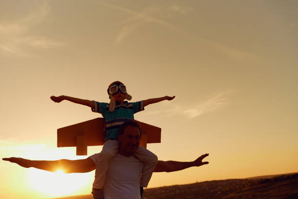 istock Father and son  at sunset in natur 964220192