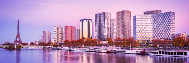 istock Paris skyline, Eiffel tower and buildings at sunset, reflection in the river Seine 964220226